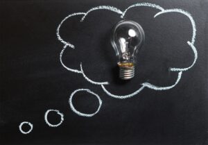 A thought bubble surrounding a lightbulb